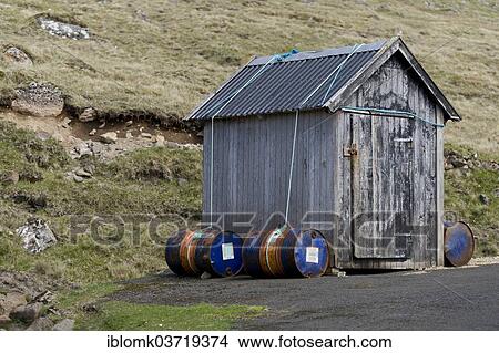 "Barrels filled with sand to keep the hut on the ground in high winds, Kirkja, Fugloy, Norooyar, Faroe Islands, Denmark, Europe" View Large Photo Image Picture - "Barrels filled with sand to keep the hut on the ground in high winds, Kirkja, Fugloy, Norooyar, Faroe Islands, Denmark, Europe". Fotosearch