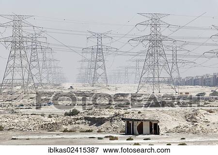 Barren land with electricity transmission pylons, urban development area, Nakheel Harbour, Dubai, United Arab Emirates, Middle East, Asia View Large Photo Image Stock Photo - Barren land with electricity transmission pylons, urban development area, Nakheel Harbour, Dubai, United Arab Emirates, Middle East, Asia. Fotosearch