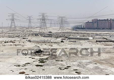 Barren land with electricity transmission pylons, urban development area, Nakheel Harbour, Dubai, United Arab Emirates, Middle East, Asia View Large Photo Image Stock Photo - Barren land with electricity transmission pylons, urban development area, Nakheel Harbour, Dubai, United Arab Emirates, Middle East, Asia. Fotosearch