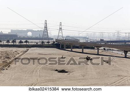 Barren land with pylons of the Metro line, urban development area, Dubai, United Arab Emirates, Middle East, Asia View Large Photo Image Picture - Barren land with pylons of the Metro line, urban development area, Dubai, United Arab Emirates, Middle East, Asia. Fotosearch