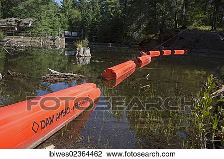 "Barriers warn canoers away from a dam at the head of Burnt Island Lake, Algonquin Provincial Park, Ontario, Canada, North America" View Large Photo Image Stock Image - "Barriers warn canoers away from a dam at the head of Burnt Island Lake, Algonquin Provincial Park, Ontario, Canada, North America". Fotosearch
