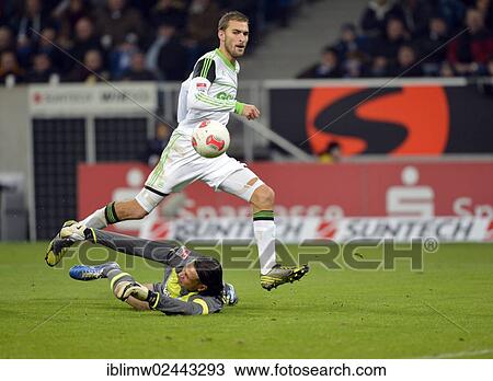 "Bas DOST of VfL Wolfsburg, playing the ball, outplaying goalkeeper Tim WIESE of TSG 1899 Hoffenheim, Wirsol Rhein-Neckar-Arena, Sinsheim-Hoffenheim, Baden-Wuerttemberg, Germany, Europe" View Large Photo Image Stock Image - "Bas DOST of VfL Wolfsburg, playing the ball, outplaying goalkeeper Tim WIESE of TSG 1899 Hoffenheim, Wirsol Rhein-Neckar-Arena, Sinsheim-Hoffenheim, Baden-Wuerttemberg, Germany, Europe". Fotosearch