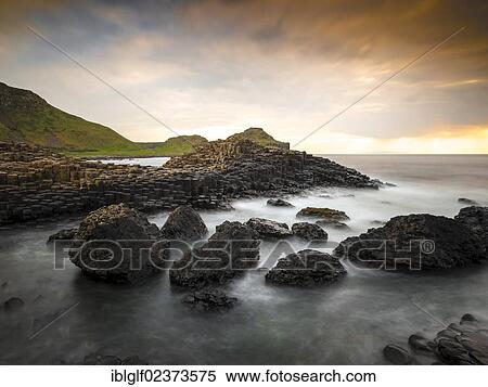 "Basaltic rocks on the shore with waves, Giant's Causeway, Coleraine, Northern Ireland, United Kingdom, Europe" View Large Photo Image Stock Photography - "Basaltic rocks on the shore with waves, Giant's Causeway, Coleraine, Northern Ireland, United Kingdom, Europe". Fotosearch
