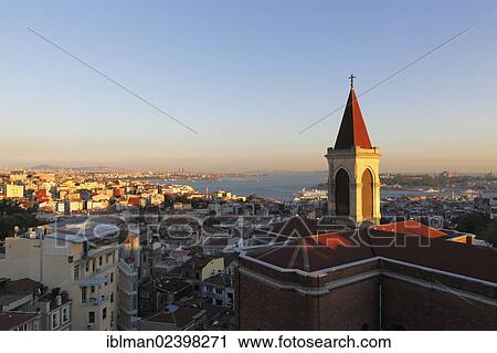 Stock Image - "Basilica of St. Anthony, St. Anthony of Padua Church, Beyoglu distrct and the Bosphorus, Istanbul, Turkey, Europe, Asia". Fotosearch
