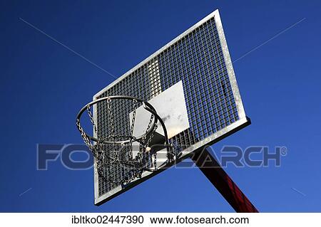 Stock Image - "Basketball hoop at a public outdoor basketball court, Cologne-Kalk, North Rhine-Westphalia, Germany, Europe". Fotosearch