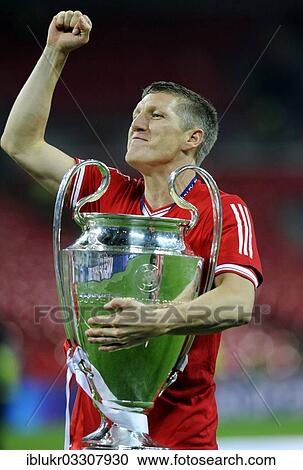 "Bastian Schweinsteiger cheering jubilantly while holding the trophy, UEFA Champions League Final 2013, Borussia Dortmund - FC Bayern Munich, Wembley-Stadium, London, London region, England, United Kingdom, Europe" View Large Photo Image Stock Image - "Bastian Schweinsteiger cheering jubilantly while holding the trophy, UEFA Champions League Final 2013, Borussia Dortmund - FC Bayern Munich, Wembley-Stadium, London, London region, England, United Kingdom, Europe". Fotosearch
