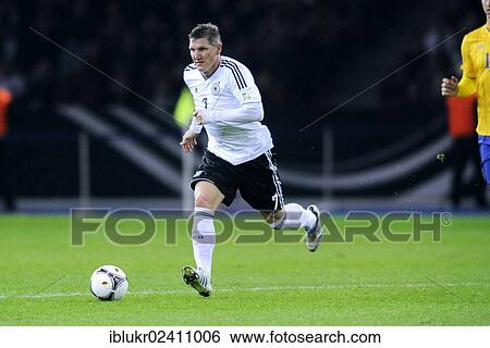 "Bastian Schweinsteiger during the qualifying match for the FIFA World Cup 2014, Germany - Sweden 4: 4, Olympic Stadium, Berlin, Germany, Europe" View Large Photo Image Stock Photograph - "Bastian Schweinsteiger during the qualifying match for the FIFA World Cup 2014, Germany - Sweden 4: 4, Olympic Stadium, Berlin, Germany, Europe". Fotosearch