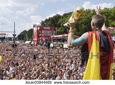 "Bastian Schweinsteiger shows the fans the trophy, reception of the German national team after their victory at the FIFA World Cup 2014, fan party at the Brandenburg Gate, Berlin, Germany, Europe" View Large Photo Image Stock Photography - "Bastian Schweinsteiger shows the fans the trophy, reception of the German national team after their victory at the FIFA World Cup 2014, fan party at the Brandenburg Gate, Berlin, Germany, Europe". Fotosearch