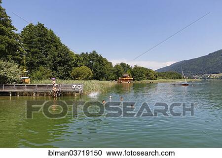 "Bathers in Lake Ossiach, St. Urban, Carinthia, Austria, Europe" View Large Photo Image Stock Image - "Bathers in Lake Ossiach, St. Urban, Carinthia, Austria, Europe". Fotosearch