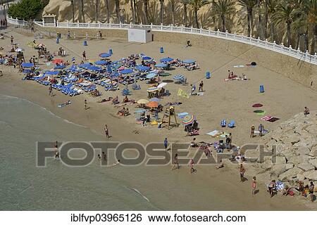 Stock Photograph - "Bathers on Playa Poniente, Benidorm, Costa Blanca, Spain beach". Fotosearch