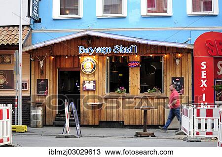 Stock Image - "Bavarian pub in the red light district, Hannover, Lower Saxony, Germany, Europe". Fotosearch