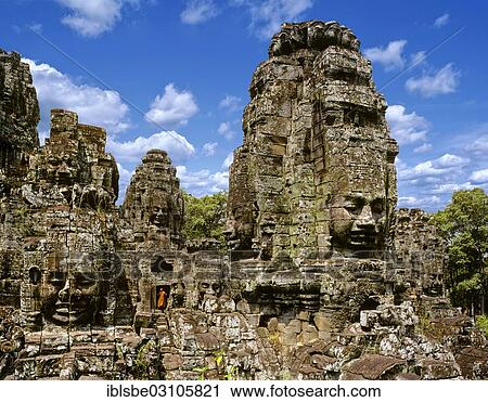 Stock Image - "Bayon temple, monk, face towers, faces of Bodhisattva Lokeshvara, Avalokiteshvara, Angkor Thom, Siem Reap Province, Cambodia, Asia". Fotosearch