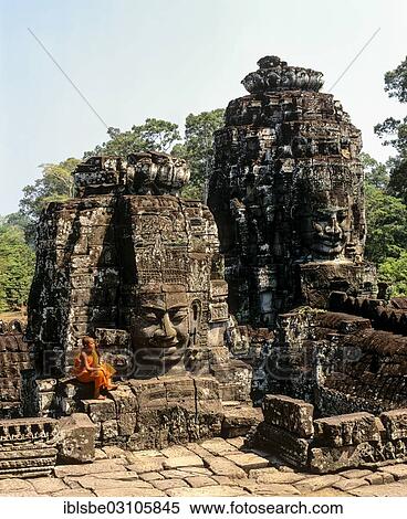 Stock Photography - "Bayon temple, monk, face towers, faces of Avalokiteshvara, Angkor Thom, Siem Reap Province, Cambodia, Asia". Fotosearch