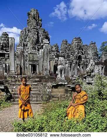Stock Image - "Bayon temple, monks, novices at the southern entrance, face towers, Angkor Thom, Siem Reap Province, Cambodia, Asia". Fotosearch