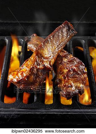 BBQ spare ribs being cooked over open flames View Large Photo Image Stock Photography - BBQ spare ribs being cooked over open flames. Fotosearch