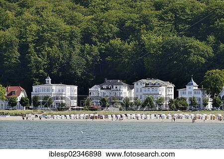 "Beach and roofed wicker beach chairs in front of resort or Baeder architecture, Binz, Mecklenburg-Western Pomerania, Germany, Europe" View Large Photo Image Stock Photo - "Beach and roofed wicker beach chairs in front of resort or Baeder architecture, Binz, Mecklenburg-Western Pomerania, Germany, Europe". Fotosearch