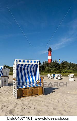 "Beach chair on the beach in front of the lighthouse, Hornum, Sylt, North Frisia, Schleswig-Holstein, Germany, Europe" View Large Photo Image Stock Image - "Beach chair on the beach in front of the lighthouse, Hornum, Sylt, North Frisia, Schleswig-Holstein, Germany, Europe". Fotosearch