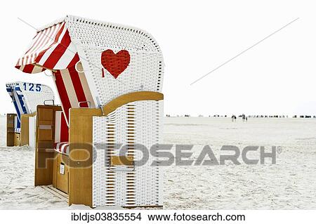 Picture - "Beach chair with a painted heart, Norddorf, Amrum, North Frisian Islands, Schleswig-Holstein, Germany, Europe". Fotosearch