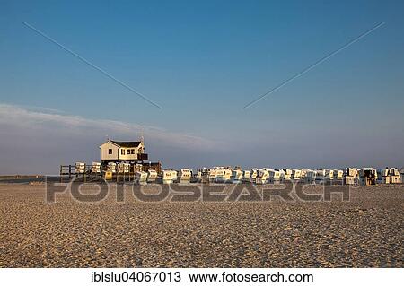"Beach chairs and a building on stilts in the evening light, St Peter-Ording, North Frisia, Schleswig-Holstein, Germany, Europe" View Large Photo Image Stock Image - "Beach chairs and a building on stilts in the evening light, St Peter-Ording, North Frisia, Schleswig-Holstein, Germany, Europe". Fotosearch