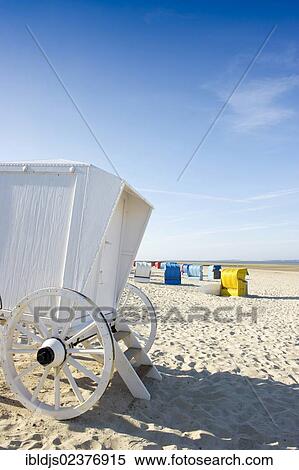 "Beach chairs and a historical changing hut or cart, Utersum, Foehr island, North Frisia, Germany, Europe" View Large Photo Image Stock Photography - "Beach chairs and a historical changing hut or cart, Utersum, Foehr island, North Frisia, Germany, Europe". Fotosearch