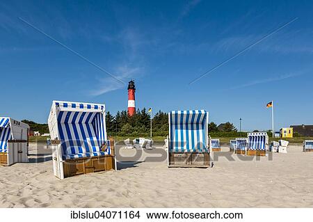 Picture - "Beach chairs on the beach in front of the lighthouse, Hornum, Sylt, North Frisia, Schleswig-Holstein, Germany, Europe". Fotosearch