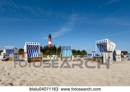 "Beach chairs on the beach in front of the lighthouse, Hornum, Sylt, North Frisia, Schleswig-Holstein, Germany, Europe" View Large Photo Image Stock Image - "Beach chairs on the beach in front of the lighthouse, Hornum, Sylt, North Frisia, Schleswig-Holstein, Germany, Europe". Fotosearch