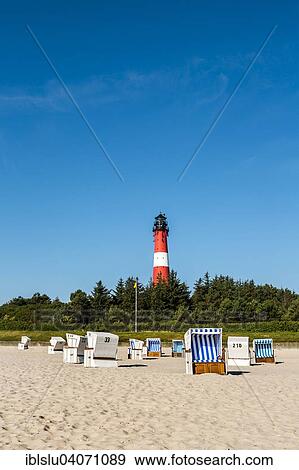 "Beach chairs on the beach in front of the lighthouse, Hornum, Sylt, North Frisia, Schleswig-Holstein, Germany, Europe" View Large Photo Image Stock Photo - "Beach chairs on the beach in front of the lighthouse, Hornum, Sylt, North Frisia, Schleswig-Holstein, Germany, Europe". Fotosearch