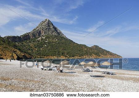 "Beach in Adrasan Bay, striking rocky hill at back, Kumluca, Lycia, Province of Antalya, Turkey, Asia" View Large Photo Image Stock Photograph - "Beach in Adrasan Bay, striking rocky hill at back, Kumluca, Lycia, Province of Antalya, Turkey, Asia". Fotosearch