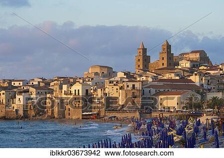 "Beach in front of Cathedral-Basilica of the Holy Saviour, Basilica Cattedrale del Santissimo Salvatore in the evening light, Cefalu, Province of Palermo, Sicily, Italy, Europe" View Large Photo Image Stock Image - "Beach in front of Cathedral-Basilica of the Holy Saviour, Basilica Cattedrale del Santissimo Salvatore in the evening light, Cefalu, Province of Palermo, Sicily, Italy, Europe". Fotosearch