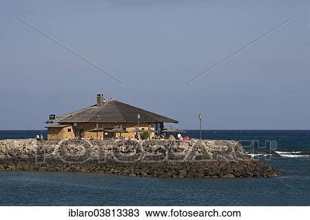 "Beach restaurant on the beach of Caleta de Fuste, Fuerteventura, Canary Islands, Spain, Europe" View Large Photo Image Stock Image - "Beach restaurant on the beach of Caleta de Fuste, Fuerteventura, Canary Islands, Spain, Europe". Fotosearch