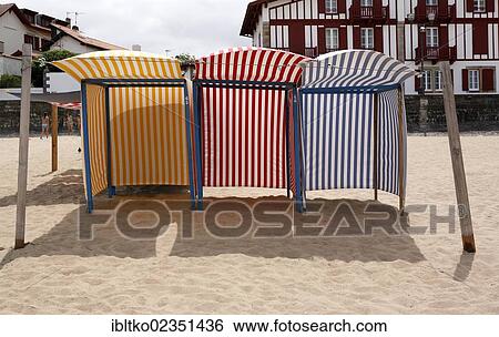 Stock Photograph - "Beach shelters on the beach of the town Saint-Jean-de-Luz, Aquitaine, Departement Pyrenees-Atlantiques, France, Europe". Fotosearch