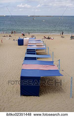 Stock Photo - "Beach shelters or huts, on the beach of the town Saint-Jean-de-Luz, Aquitaine, Departement Pyrenees-Atlantiques, France, Europe". Fotosearch