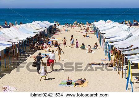 Beach with beach tents, Praia da Nazare, Nazare, Oeste, Leiria District, Portugal, Europe View Large Photo Image Picture - Beach with beach tents, Praia da Nazare, Nazare, Oeste, Leiria District, Portugal, Europe. Fotosearch