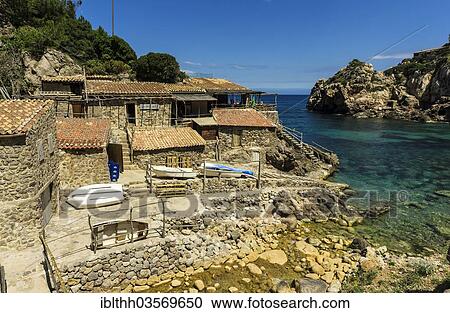 Stock Image - "Beach with cafe at Cala Deia, Deia, Majorca, Balearic Islands, Spain, Europe". Fotosearch