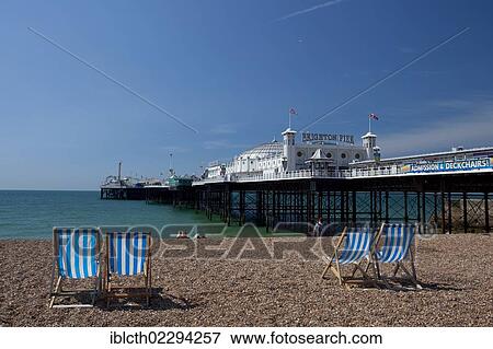 "Beach with deck chairs and a view towards Brighton Pier, Brighton, England, United Kingdom, Europe" View Large Photo Image Stock Photo - "Beach with deck chairs and a view towards Brighton Pier, Brighton, England, United Kingdom, Europe". Fotosearch