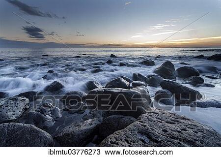 "Beach with large rocks in the early morning, Caleta del Mojon Blanco, Orzola, Lanzarote, Canary Islands, Spain, Europe" View Large Photo Image Stock Image - "Beach with large rocks in the early morning, Caleta del Mojon Blanco, Orzola, Lanzarote, Canary Islands, Spain, Europe". Fotosearch