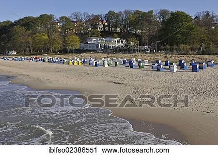 Stock Image - "Beach with roofed beach chairs, Baltic Sea resort town of Goehren, Ruegen, Mecklenburg-Western Pomerania, Germany, Europe". Fotosearch