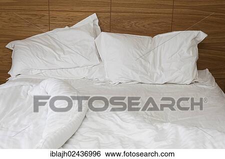 Stock Photograph - Bed which has been slept in. Fotosearch