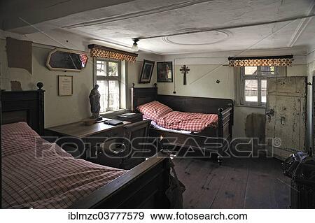 Stock Photo - "Bedroom with a desk, furnished as in 1920, in a farmhouse originally from Kleinrinderfeld, built in 1779, relocated to the Franconian Open Air Museum in Bad Windsheim, Middle Franconia, Bavaria, Germany, Europe". Fotosearch