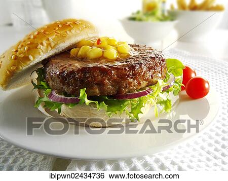 Beef burger with sweetcorn relish and salad in a bun View Large Photo Image Stock Photograph - Beef burger with sweetcorn relish and salad in a bun. Fotosearch