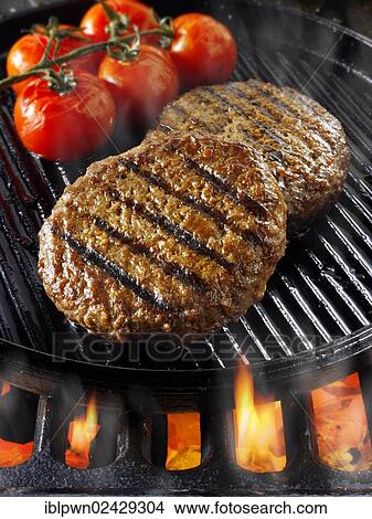 Beef burgers being cooked View Large Photo Image Picture - Beef burgers being cooked. Fotosearch
