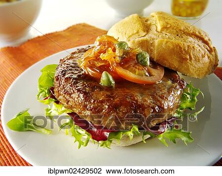 Beef burgers in a bread bun with salad and garnish View Large Photo Image Stock Image - Beef burgers in a bread bun with salad and garnish. Fotosearch
