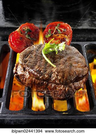 Beef fillet steaks and tomatoes on a BBQ View Large Photo Image Picture - Beef fillet steaks and tomatoes on a BBQ. Fotosearch