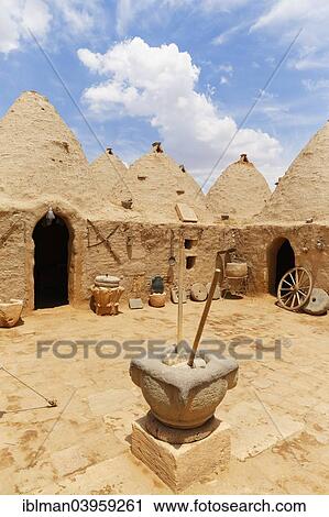 Stock Image - "Beehive-shaped mud-brick trulli houses, Harran, Sanliurfa Province, Urfa Province, Southeastern Anatolia Region, Anatolia, Turkey, Asia". Fotosearch