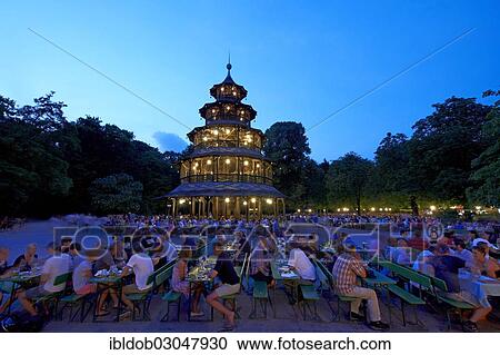Stock Image - "Beer garden at the Chinese Tower in the English Garden, Munich, Upper Bavaria, Bavaria, Germany, Europe". Fotosearch