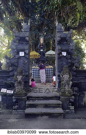 "Believers making offerings in a small side temple, Tirta Empul Water Temple, Bali, Indonesia, Asia" View Large Photo Image Stock Photo - "Believers making offerings in a small side temple, Tirta Empul Water Temple, Bali, Indonesia, Asia". Fotosearch