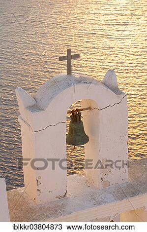 Stock Image - "Bell tower at sunset, Thira, Santorini, Cyclades, Greece, Europe". Fotosearch