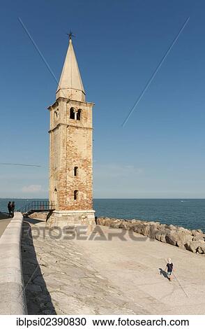 "Bell tower, lighthouse of Church of Blessed Virgin of Angel, Santuario della Madonna dell'Angelo, on Adriatic Sea, Caorle, Veneto, Italy, Europe" View Large Photo Image Stock Image - "Bell tower, lighthouse of Church of Blessed Virgin of Angel, Santuario della Madonna dell'Angelo, on Adriatic Sea, Caorle, Veneto, Italy, Europe". Fotosearch