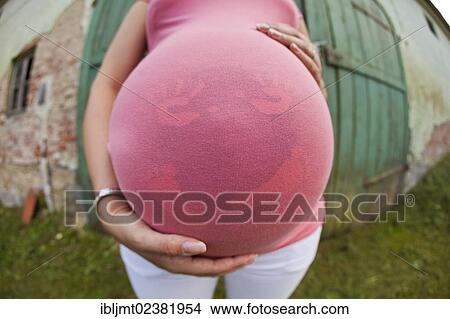 Belly of a pregnant woman View Large Photo Image Picture - Belly of a pregnant woman. Fotosearch