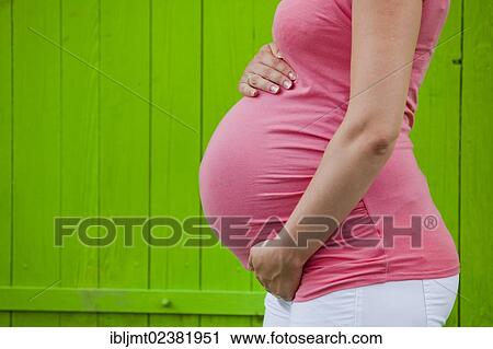 Belly of a pregnant woman View Large Photo Image Stock Image - Belly of a pregnant woman. Fotosearch